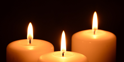 Three lit candles